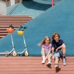 Ninebot KickScooter ZING C10_Lifestyle picture_KickScooter standing_kids sitting (1)